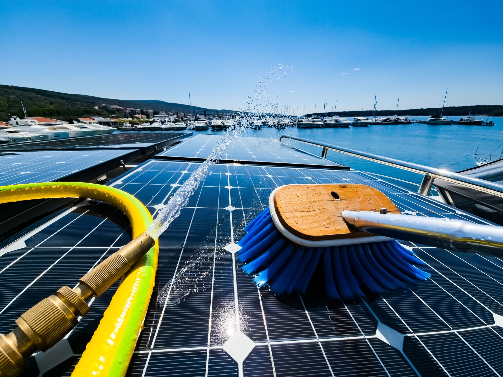 Solar Panel Cleaning at Marina with Blue Brush